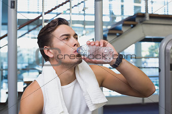 Fit man taking a break from working out