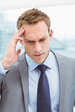 Businessman with severe headache at office