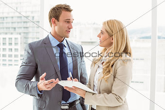 Businessman talking to his secretary