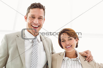 Happy business couple in office