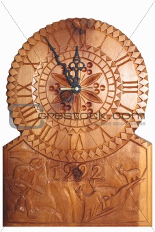 Clock carved on wood