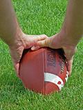 holding a football
