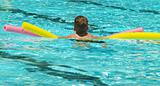 boy using floats in pool