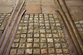 Old disused tram tracks with granite cobbles inlay