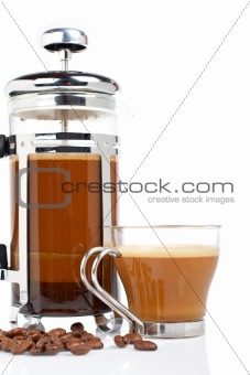 Cup and coffee pot with beans