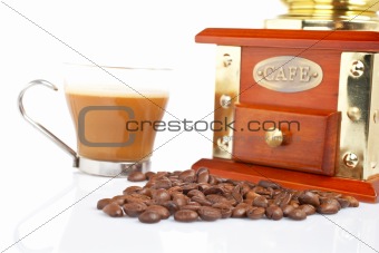 Cup, grinder, coffee pot and beans