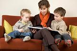 Mother And Two Sons Reading A Book 3