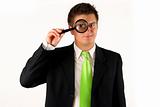 young businessman with magnifying glass