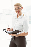 Businesswoman with diary in office