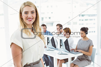 Businesswoman with executives using computers