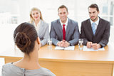 Business people interviewing woman