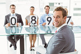 Interview panel holding score cards in office