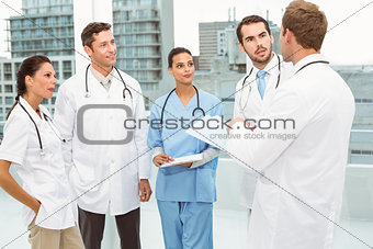 Male and female doctors in meeting