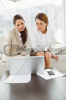 Young businesswomen using laptop