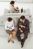 Business people sitting on couch