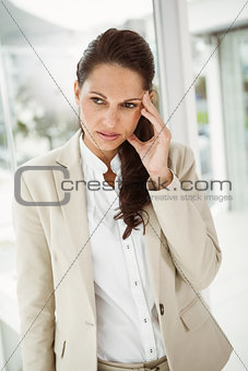Businesswoman with headache at office