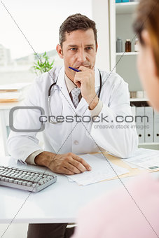 Doctor in discussion with patient at desk