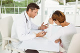 Doctor in discussion with patient in medical office