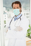 Doctor wearing surgical mask in hospital