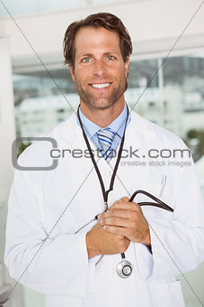 Confident male doctor in medical office