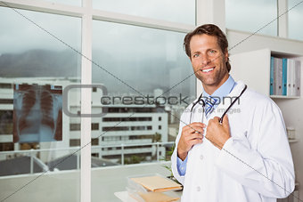 Smiling male doctor in medical office