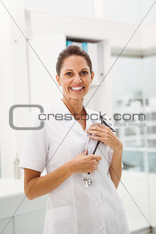 Smiling female doctor with stethoscope at medical office