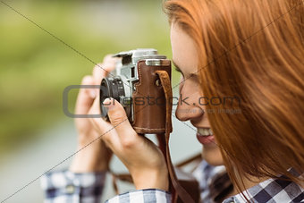 Redhead woman taking a photo