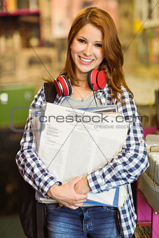 Smiling girl holding some vinyls