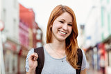Portrait of a smiling woman with backpack