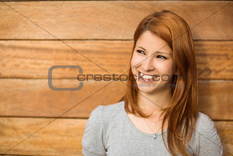 Pretty redhead smiling and thinking