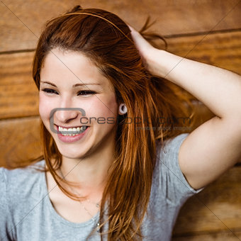 Portrait of a cheerful pretty redhead laughing