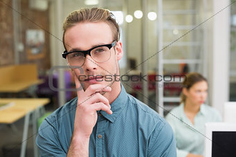 Serious male photo editor in office