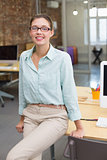 Smiling female photo editor in office