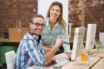 Smiling photo editors in office