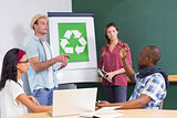Creative meeting with recycling symbol on whiteboard