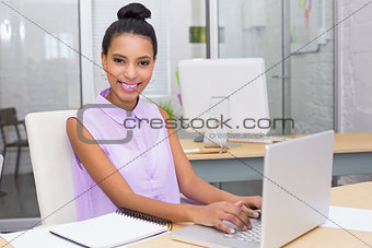 Portrait of businesswoman using laptop