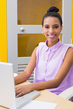 Portrait of businesswoman using laptop