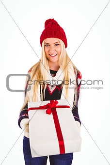 Festive blonde holding a gift