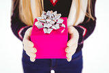 Festive blonde holding a gift