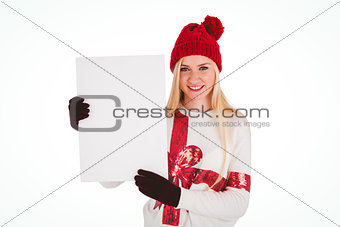 Festive blonde showing a blank page