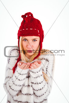 Festive blonde blowing over hands