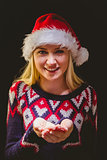 Festive blonde holding her hands out