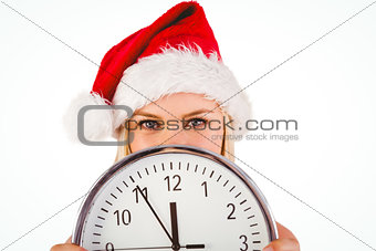 Festive blonde holding a clock