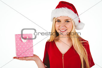 Festive blonde holding a gift bag