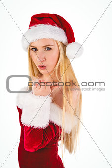 Festive blonde blowing over hand