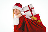 Festive blonde carrying sack of presents