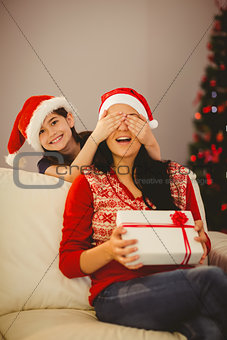Daughter surprising her mother with christmas gift
