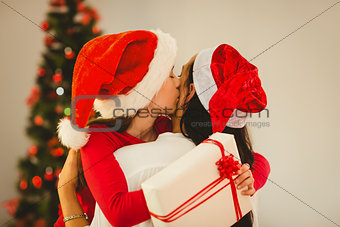 Mother and daughter hugging at christmas