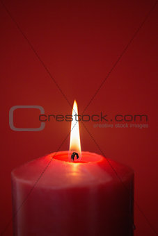 Red candle burning brightly