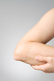 Plaster on female arm